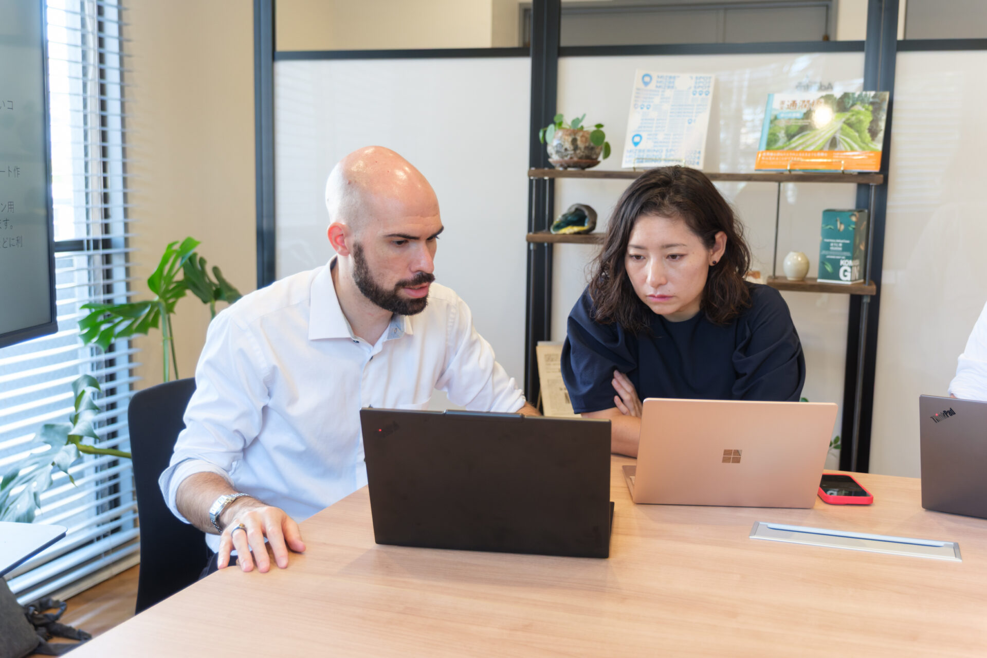Adastra staff in a meeting at the office